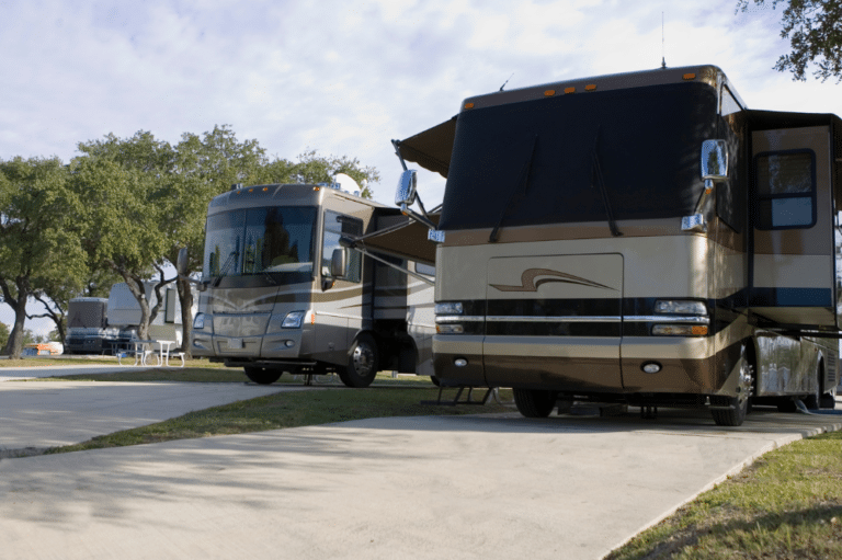 Image of a big RV parked in an RV Park, featuring RV park tips.